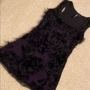 Black mesh with black fringe flowers over purple